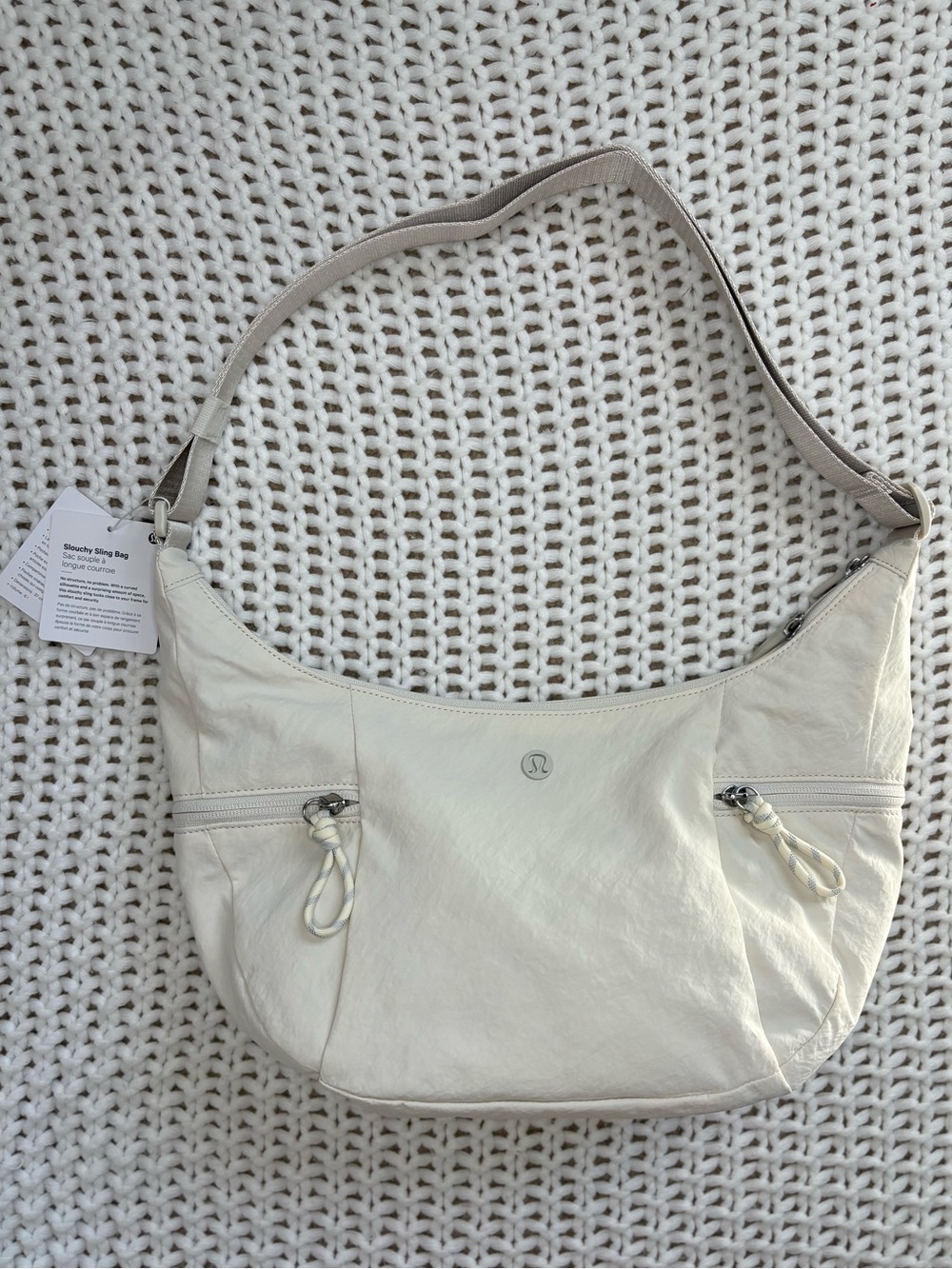 NWT lululemon slouchy sling bag 6L in light ivory/silver